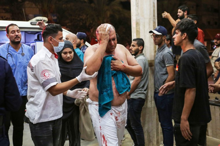 A Palestinians man injured in Israeli air raids arrive at Nasser Medical Hospital