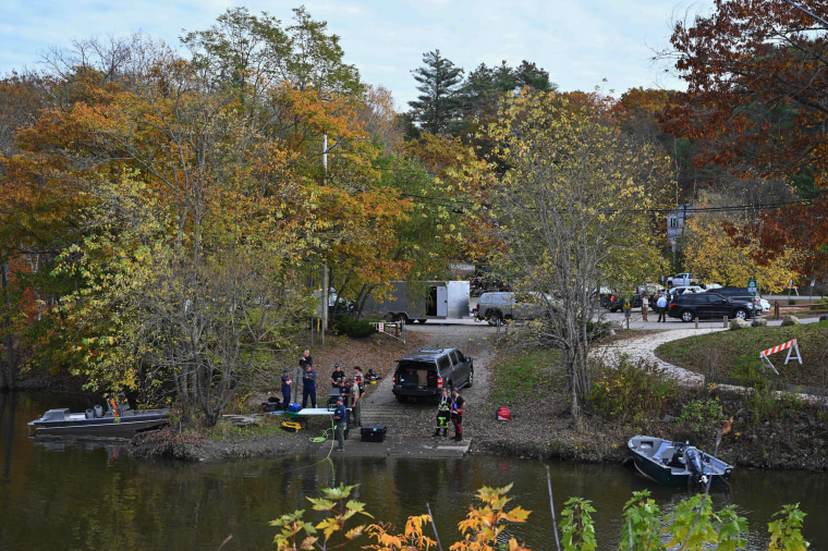 Law enforcement officials prepare to search the Androscoggin River in Lisbon Falls, Maine, on Oct. 27, 2023.