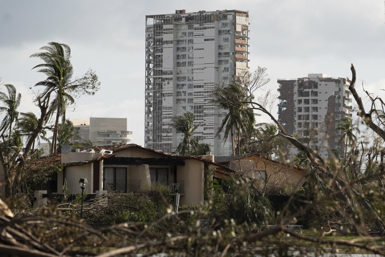 Buildings are surrounded by debris in the aftermath of Hurricane Otis in Acapulco, Mexico, Friday, Oct. 27, 2023. 