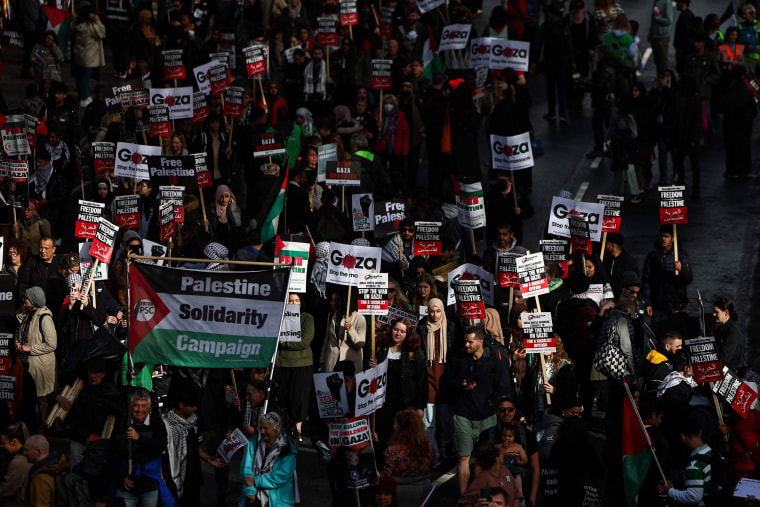 People partake in a 'March For Palestine' in London.