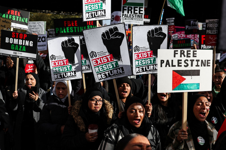 People partake in a 'March For Palestine' in London.