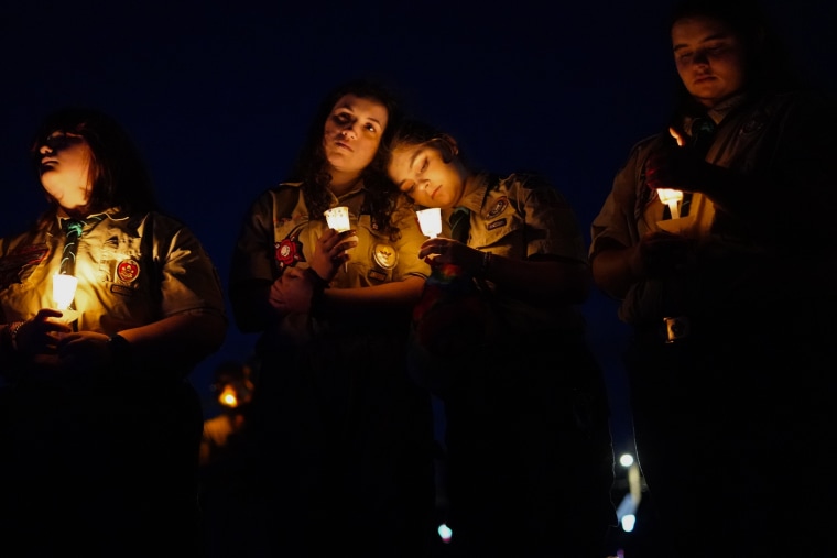 People gather Saturday, Oct. 28, 2023, at a vigil in Lisbon, Maine, for the victims of the mass shootings in Lewiston.