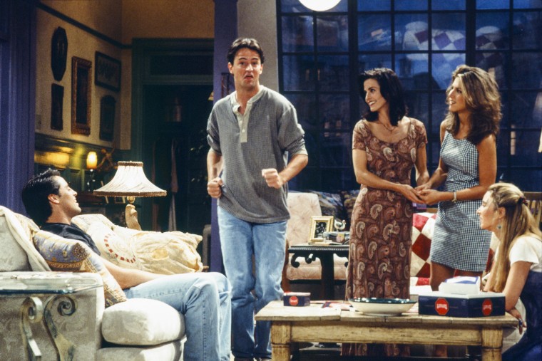 Image: Matthew Perry, as Chandler Bing, dances on the set of "Friends" with Matt LeBlanc, Courtney Cox, Jennifer Aniston and Lisa Kudrow.