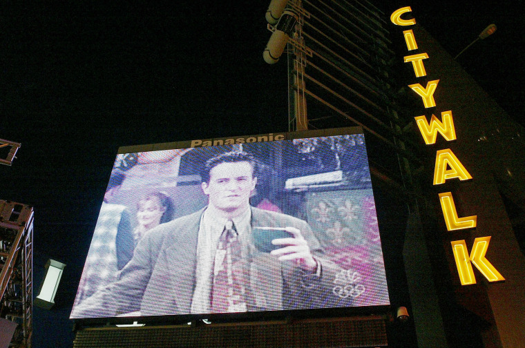 Image: Matthew Perry in the series finale of "Friends," projected at Universal City Walk in Los Angeles in 2004. The finale drew in over 52 million American viewers.