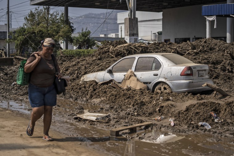 A woman walks through a damaged zone in the aftermath of Hurricane Otis in Acapulco, Mexico, on Oct. 29, 2023. 