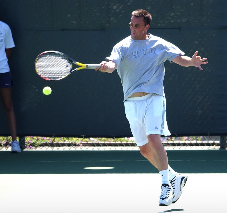 Matthew Perry plays in a celebrity tennis tournament in 2002. 
