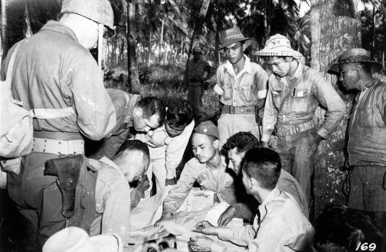 Panay Guerilla Leaders In Conference with American Division G-2 soldiers