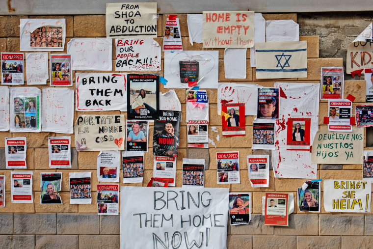 Posters, pictures and signs calling for the return of the hostages near the Ministry of Defense in Tel Aviv. 
