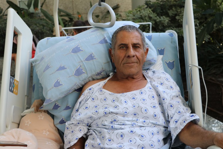 Adnan Aboubaker, 71, who was hospitalized after having a fall, lies on his hospital bed at the Tel Aviv Sourasky Medical Center on Thursday.