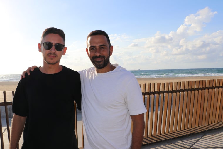 Beni Avramovich, 27, and cousin Hai Deri, 37, were almost completely alone at the Mei Ami Beach in Ashdod on Oct. 15, 2023.