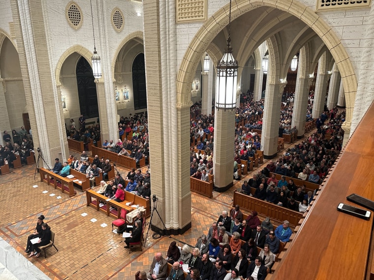 Mourners gather in the Basilica of Saints Peter and Paul in Lewiston, Maine, on Sunday evening for a vigil for mass shooting victims.