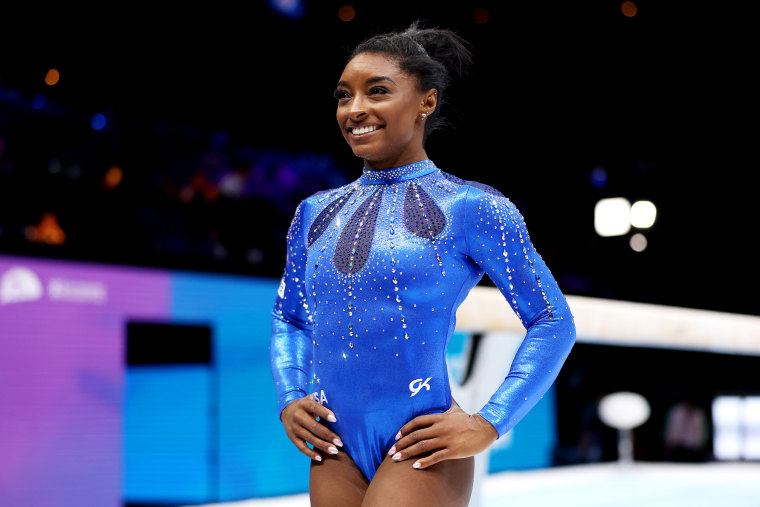 Simone Biles poses for a photo after winning the Women's All Around Final on Day Seven of the 2023 Artistic Gymnastics World Championships at Antwerp Sportpaleis on October 06, 2023 in Antwerp, Belgium. 