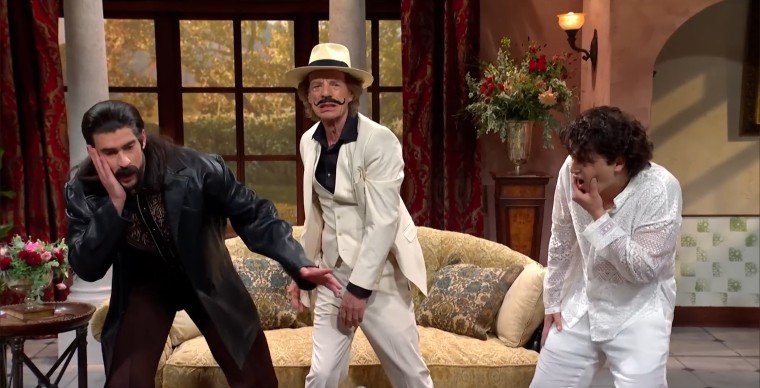 Mick Jagger, Bad Bunny, and Marcello Hernández act out a dramatic father-son scene in a telenovela.