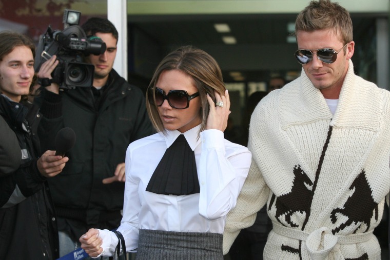 David and Victoria Beckham arrive at Ciampino Airport for Katie Holmes and Tom Cruise wedding at Bracciano on November 17, 2006 in Rome, Italy.