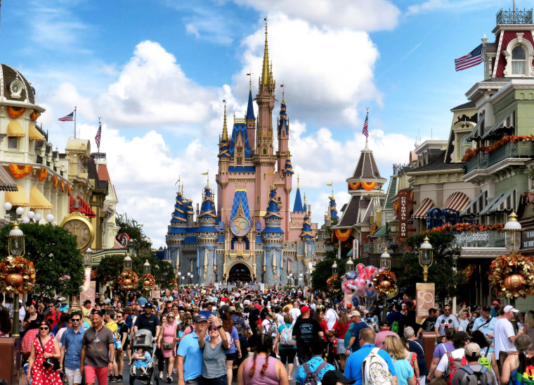 Crowds fill Main Street USA in front of Cinderella Castle at the Magic Kingdom on the 50th anniversary of Walt Disney World, in Lake Buena Vista, Florida, on Oct. 1, 2021.