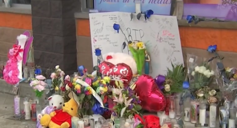 A memorial for Christine Lugo outside a Dunkin' in Philadelphia where she worked.