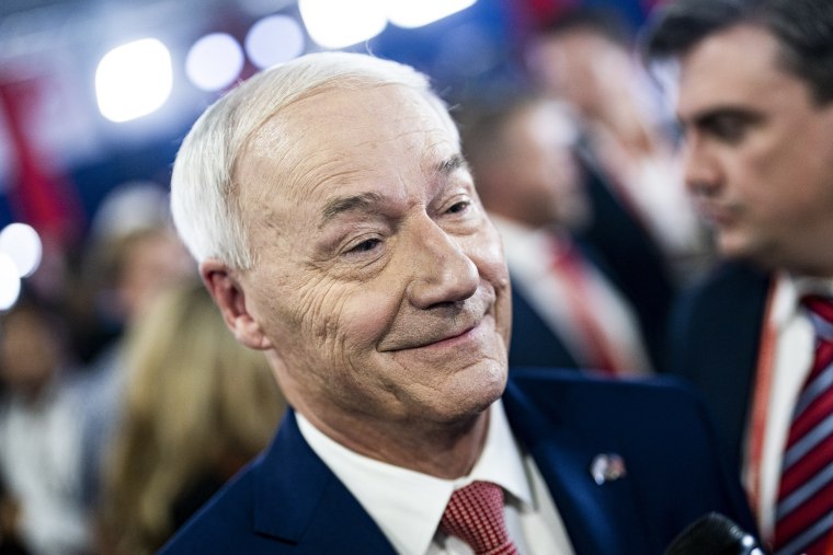 Asa Hutchinson, former governor of Arkansas and 2024 Republican presidential candidate speaks with reporters following the Republican primary presidential debate in Milwaukee, Wisc. on Aug. 23, 2023. 