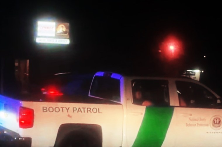 The white truck with “Booty Patrol” on the side.