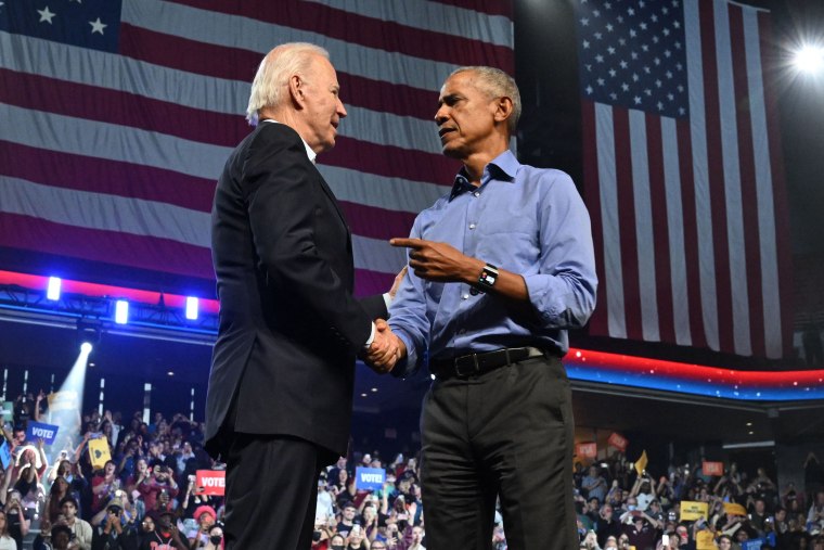 President Joe Biden and former President Barack Obama shake hands onstage at a midterms campaign rally in Pennsylvania