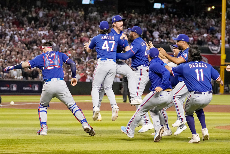 Texas Rangers celebrate after winning Game 5 of the baseball World Series against the Arizona Diamondbacks Wednesday, Nov. 1, 2023, in Phoenix.