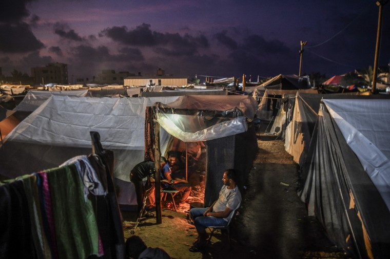 Palestinians fleeing Israeli attacks on Gaza seek refuge in UNRWA camp