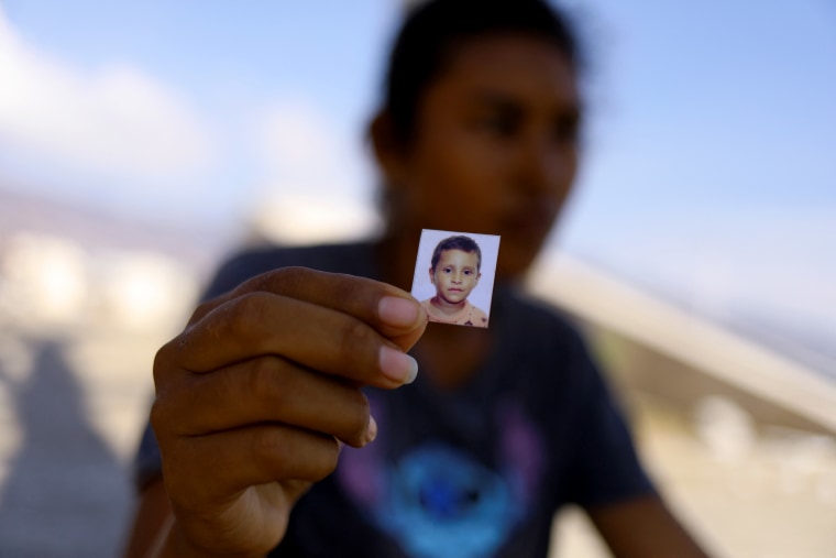 Image: Maria del Rosario Saravia Delgado holds a photo of her missing four-year-old son, Luis Alberto Lopez, in Acapulco on Nov. 1. Luis, as well as several other family members, have been missing since Hurricane Otis devastated the area.