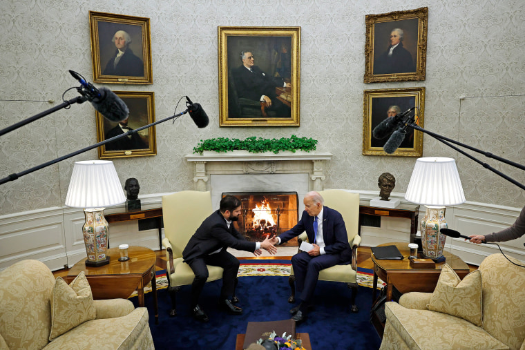 Joe Biden and Gabriel Boric shake hands during a meeting in the Oval Office. 