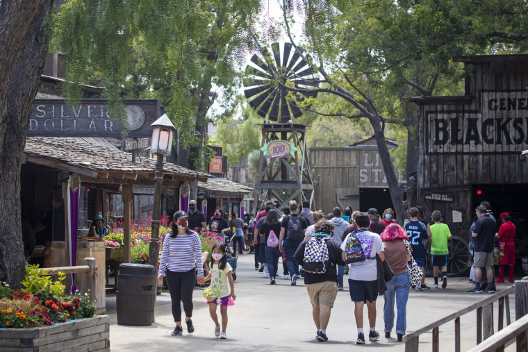 Visitors stroll through the Old West Ghost Town at Knott's Berry Farm on May 29, 2021 in Buena Park, Calif.