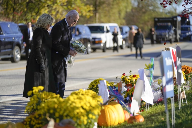 President Joe Biden and first lady Jill Biden lay flowers at Schemengees Bar and Grille, one of the sites of last week's mass shooting in Lewiston, Maine.