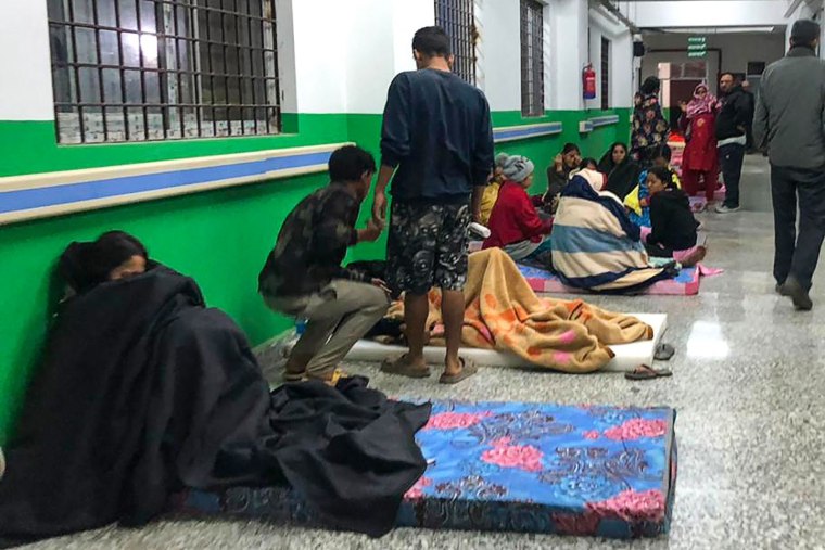 People gather in the corridor of the Jajarkot district hospital in the aftermath of an earthquake in Nepal on Nov. 4, 2023. 