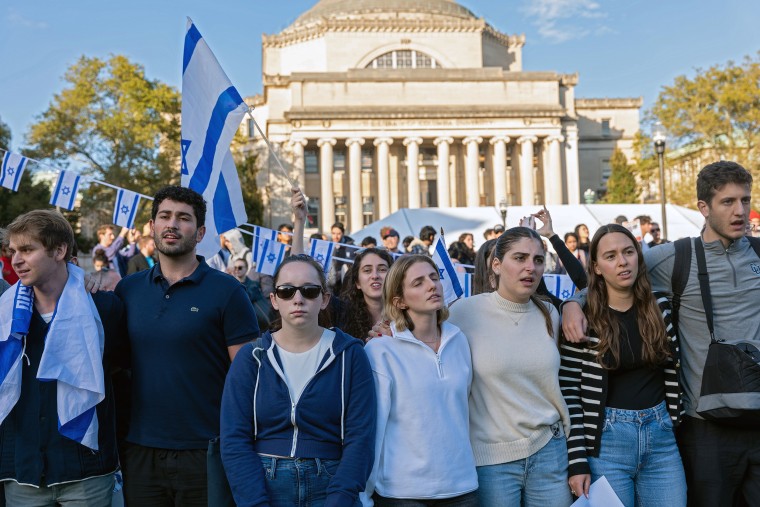 Columbia University students hold hands and participate in a rally and vigil in support of Israel 