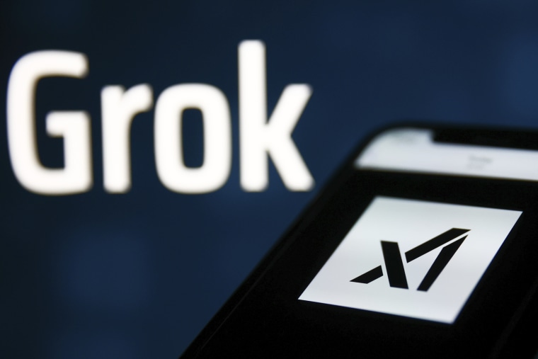 Grok sign on xAI website displayed on a laptop screen and xAI logo on website displayed on a phone screen are seen in this illustration photo taken in Krakow, Poland on Nov. 6, 2023. 