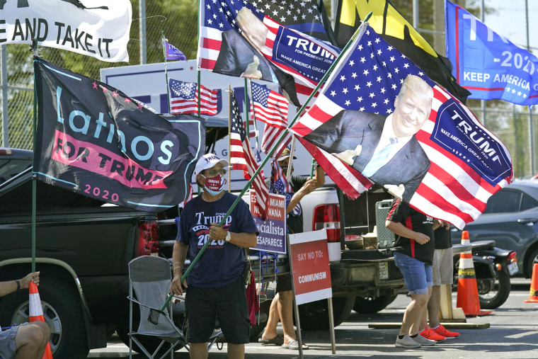 Trump supporters outside an early voting location on Oct. 27, 2020, in Hialeah, Fla. 