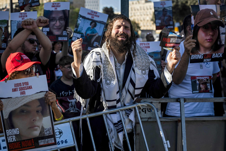 Friends and relatives of Israeli hostages abducted by Hamas demonstrate outside the Knesset in Jerusalem.