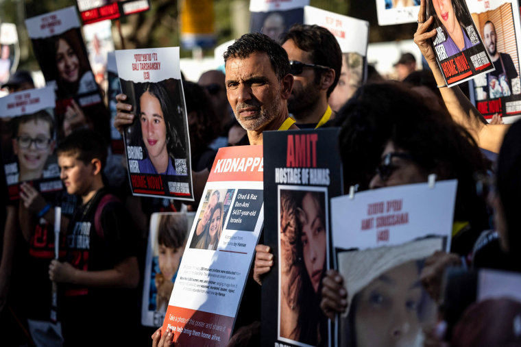 Friends and relatives of Israeli hostages abducted by Hamas demonstrate outside the Knesset in Jerusalem.