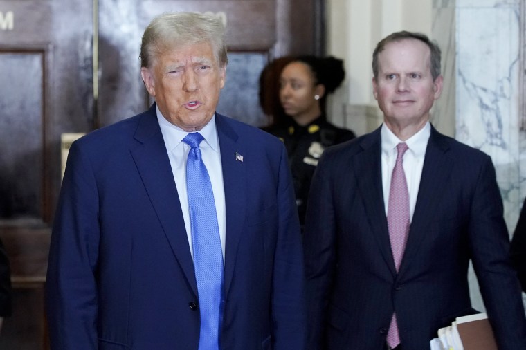 Former President Donald Trump speaks before entering the courtroom.