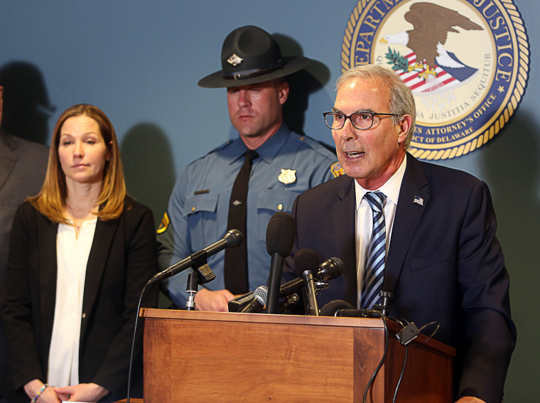 David Weiss, U.S. Attorney for the State of Delaware (right), speaks at a press conference on February 21, 2023 about an effort