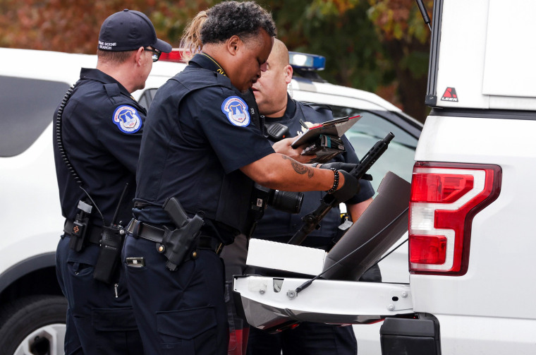 Capitol Police search a vehicle after arresting a man who was in possession of a firearm outside the Capitol.