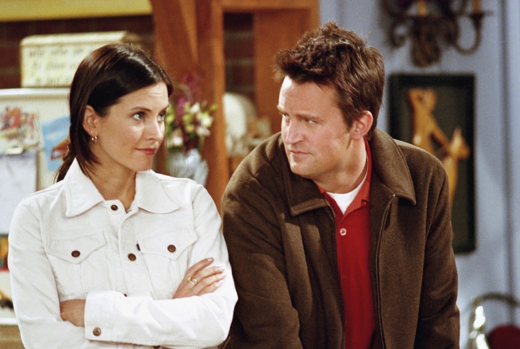 Matthew Perry looks at Courtney Cox in a still from an episode of "Friends."