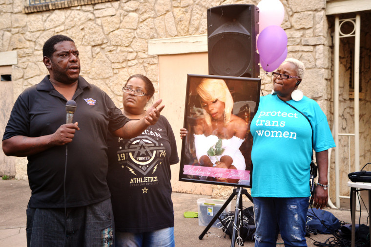 Peiree Booker, father of murdered transgender woman Muhlaysia Booker, speaks at a vigil for his daughter in Dallas in 2019. To his left is Ms. Booker's grandmother Debra Booker. 