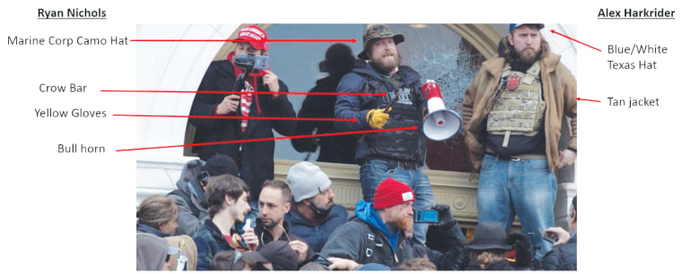 Nichols, center, holds a crow bar outside the Capitol on Jan. 6, 2021.