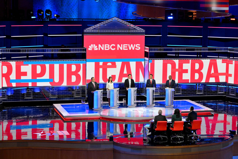 Image: The candidates take the stage at the debate on Weds. night.