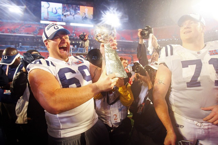 The Indianapolis Colts Matt Ulrich (69) hoists the Lombardi Trophy to celebrate the victory over the Chicago Bears in Super Bowl XLI in Miami, Florida