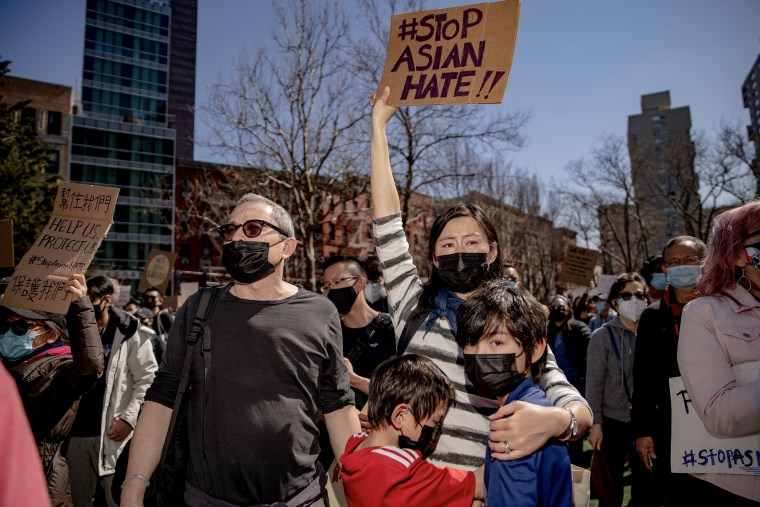 A demonstrator holds a sign  during an AAPI Rally Against Hate in New York City on March 21, 2021. 
