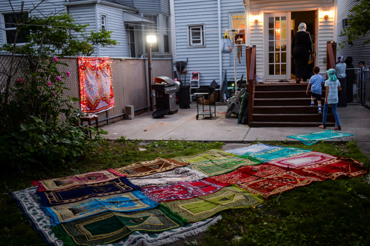 Prayer rugs lie in the backyard of a home during Ramadan in Bayonne, N.J.