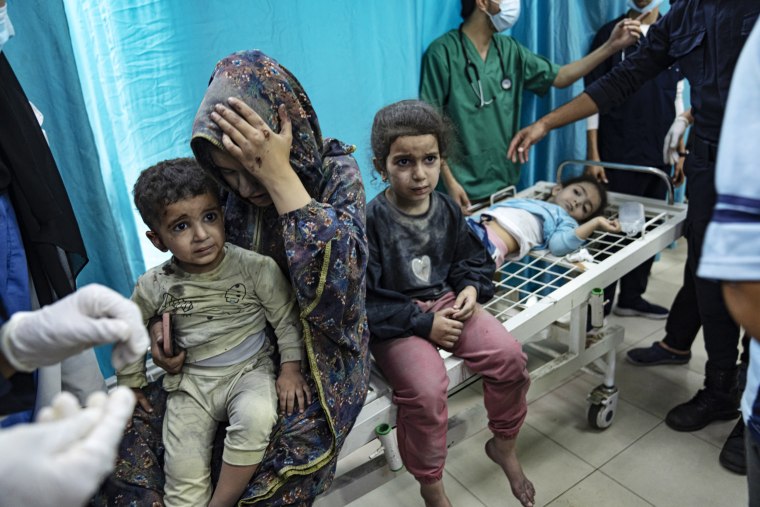 Wounded Palestinians are treated at a hospital in Khan Younis, southern Gaza, on Nov. 12, 2023.