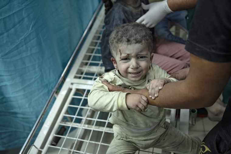 A wounded Palestinian child is treated at a hospital in Khan Younis, southern Gaza Strip, on Nov. 12, 2023.