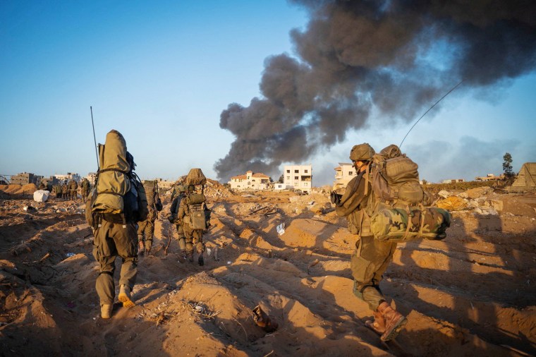 Israeli soldiers take position in the Gaza Strip on Nov. 12, 2023.