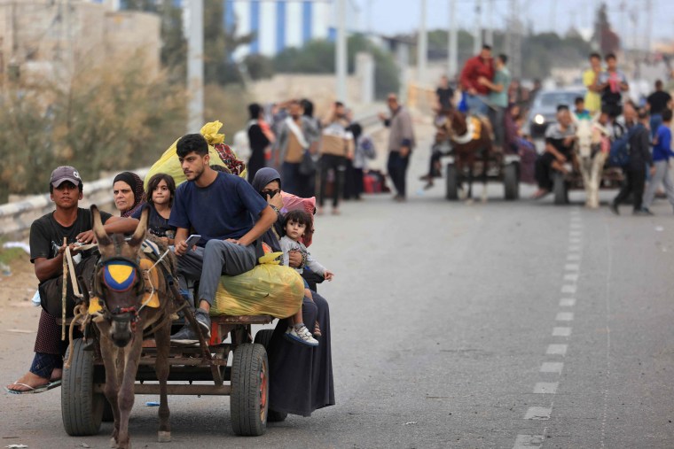 Palestinians south of Gaza City on Nov. 12, 2023, after fleeing their homes in Gaza City and the northern Gaza Strip.