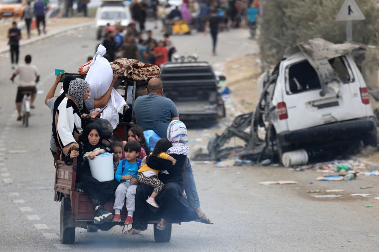 Palestinians arrive south of Gaza City after fleeing their homes in Gaza City and the Northern Gaza Strip.